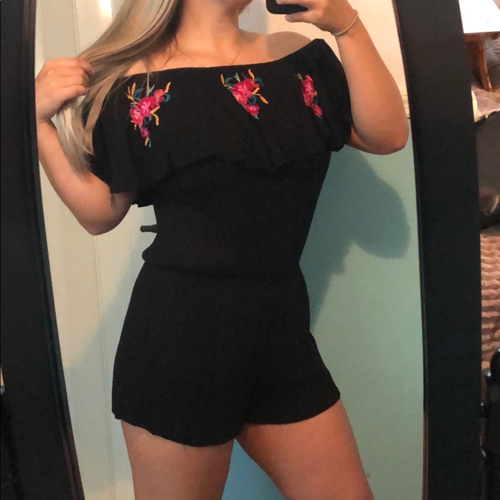 Off the shoulder black romper.